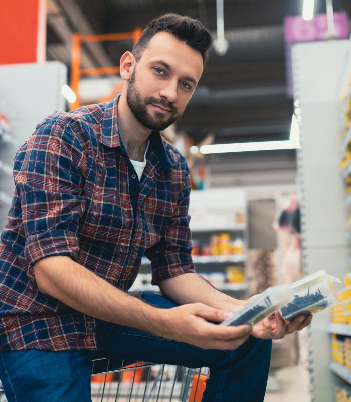 hardware store customer chooses wood screws