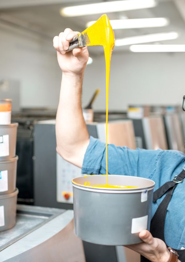 Typographer with paint at the manufacturing